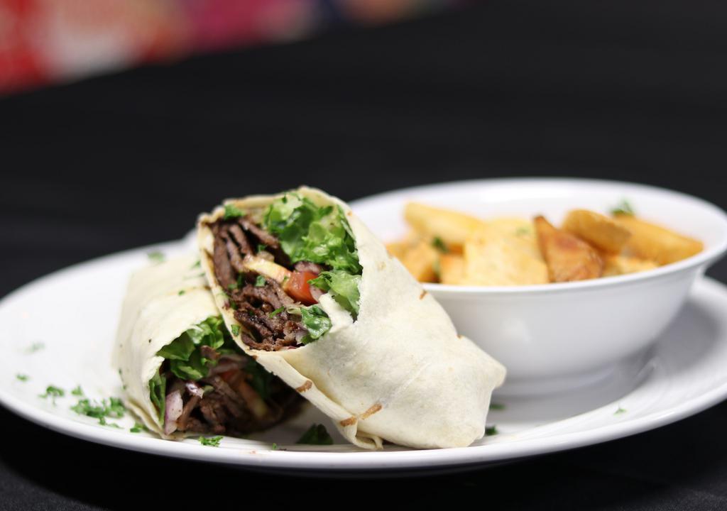 Beef And Lamb Gyro Sandwich · Tender Beef and Lamb seasoned with special herbs and spices – sliced and wrapped up in fresh and warm Pita Bread; served with Tzatziki, Tahini or Hot sauces.