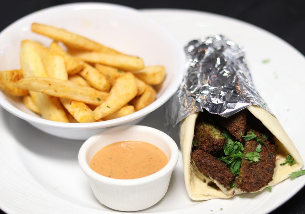 Falafel Sandwich · Sliced Falafel wrapped up in fresh and warm Pita Bread; served with Tzatziki, Tahini or Hot sauces.