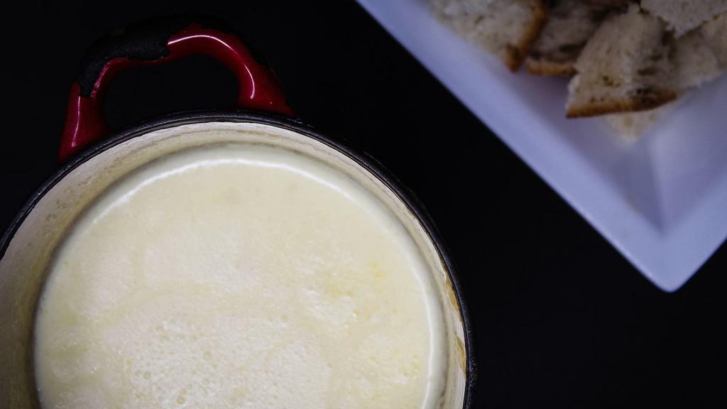 Oregon Black Truffle Fondue · traditional Swiss fondue finished with Willamette Valley black truffles and house-made oil.