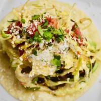 Aguacates Taco · avocado, black beans, cabbage slaw, marinated tomatoes, pickled onions, cotija.