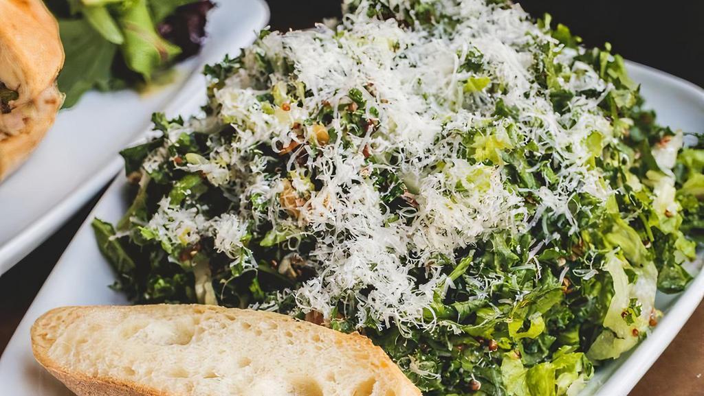 Kale · Romaine and organic kale, almond, golden raisins, organic quinoa, parmesan reggiano, shallots, lemon vinaigrette.