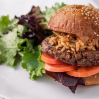 Comoncy Beyond Burger · Brioche bun, quinoa-crusted beyond meatless burger, tomatoes, crispy onions, remoulade, loca...