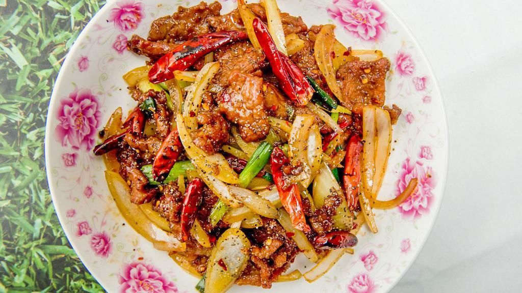 Mongolian Beef · Beef cooked with Mongolian sauce and peppers, onions.  Medium spicy