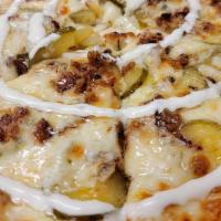 Pickle Bacon Pizza · A butter garlic base topped with mozzarella cheese, cheddar bacon and sliced dill pickles wi...
