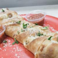 Meatball Stromboli · A  braided pizza filled with meatballs, mozzarella cheese and homemade marinara sauces baked...