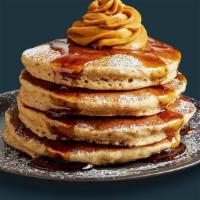 Pumpkin Pancakes (4) · Four fluffy pumpkin pancakes topped with rich pumpkin chiffon and lightly dusted with powder...