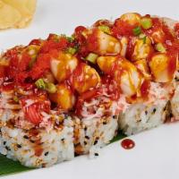 Volcano Roll · California roll topped with tossed scallop, crab meat, crushed scallions, fish egg and srira...