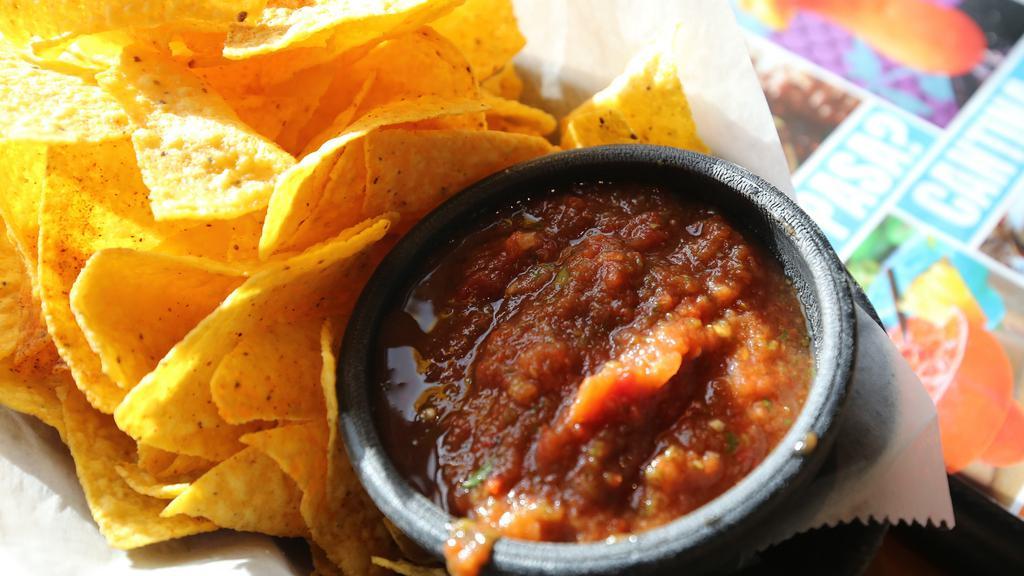 Salsas + Chips · Trio of fresh salsas + homemade chips.