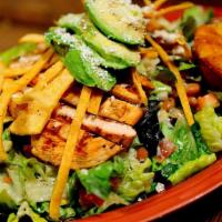Mexican Chopped Salad · Chopped lettuce, tossed with pinto beans, tomatoes, green onions, black olives, corn, cilant...