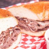 French Dip With Au Jus Grinder · Pocino Roast Beef, provolone cheese, and side of au jus. Served on toasted herb seasoned Fre...