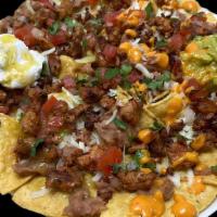 Pancho Nachos · Deep fried Corn Tortilla chips covered with delicious refried Beans , Cheese, Pico de Gallo ...