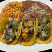 3 Tacos With Mexican Rice And Refried Beans · 3 Tacos, Onions, Cilantro with Mexican rice and Refried Beans and choice of meat
