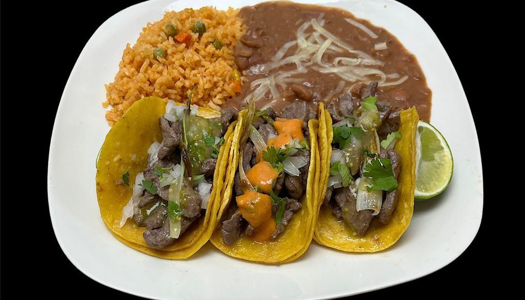 3 Tacos With Mexican Rice And Refried Beans · 3 Tacos, Onions, Cilantro with Mexican rice and Refried Beans and choice of meat