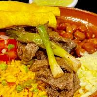 Asada Bowl · Marinated beef over a bed of Beans and Mexican rice, grilled green Onions, Pico de Gallo, Ch...