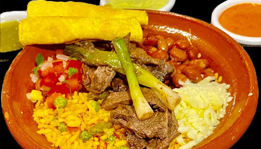Asada Bowl · Marinated beef over a bed of Beans and Mexican rice, grilled green Onions, Pico de Gallo, Cheese