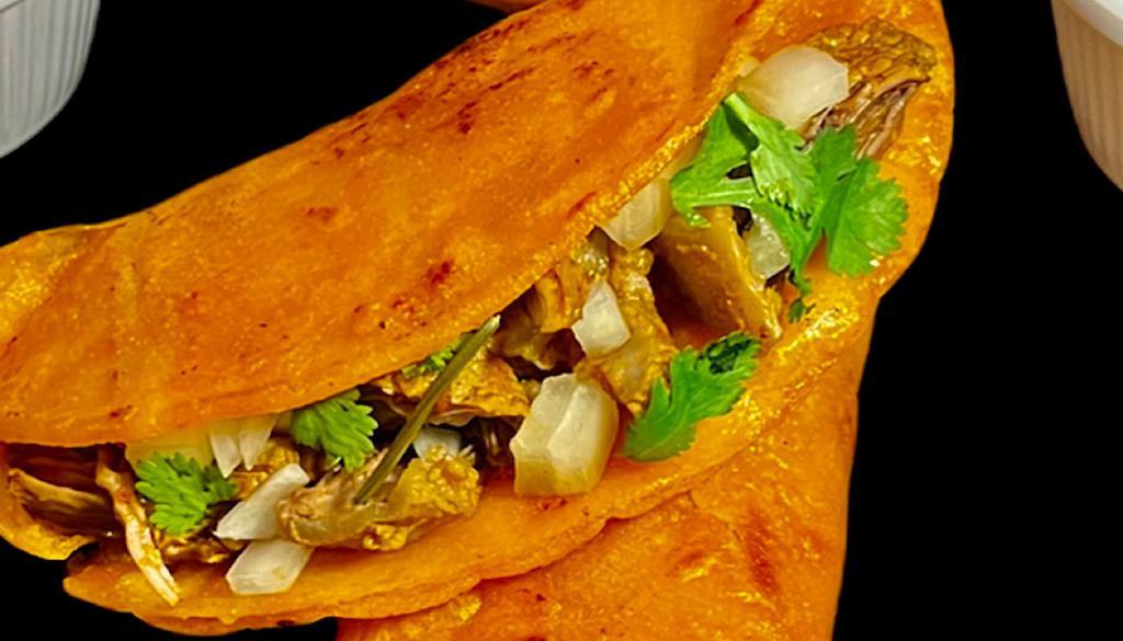 Taco Dorado De Birria ( Crispy Taco ) · Slow cooked beef , Onions, Cilantro