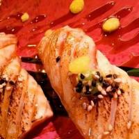 Seared Salmon (2Pcs)  · Seared Salmon  topped with sesame seeds,  sweet soy sauce, sweet wasabi sauce,  sliced lemon