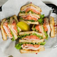 Turkey Royal Club · Turkey, bacon, lettuce, tomato, swiss cheese, and mayo on a three tier stack of toasted  whi...