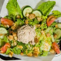 Tuna Salad  · Diced cucumbers, diced tomatoes, shredded mixed cheese,  croutons, and tuna salad on a bed o...
