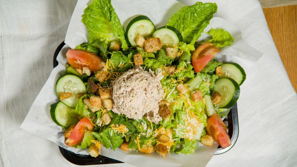 Tuna Salad  · Diced cucumbers, diced tomatoes, shredded mixed cheese,  croutons, and tuna salad on a bed of lettuce. Dressings upon request.