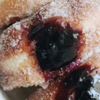 Blueberry Filled Donut · Airy, light, glazed donut loaded with sweet blueberry filling.