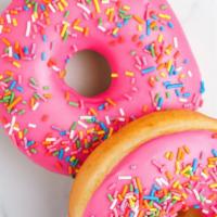 Pink Sprinkle Cake Donut · Cakey, tender, moist donut with sweet pink glaze and rainbow sprinkles.