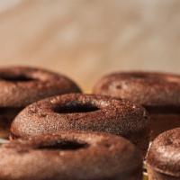 Chocolate Sprinkle Cake Donut · Cakey, tender, moist donut with chocolate glaze and rainbow sprinkles.