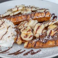 Liege Waffles With Nutella And Fresh Banana · Fresh banana, Nutella, whipped cream and a drizzle of hot fudge sauce.