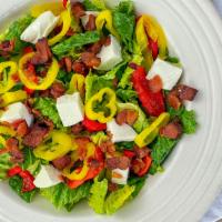 Mozzarella Fresca Salad · Romaine topped with roasted red pepper, fresh mozzarella, crispy bacon, and pepperoncini wit...