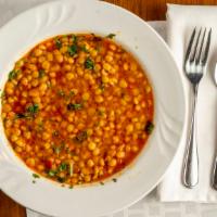 Daal Sabzi (Lentil Spinach) · A melange of chopped spinach, cilantro, parsley and scallions, cooked with onion and traditi...