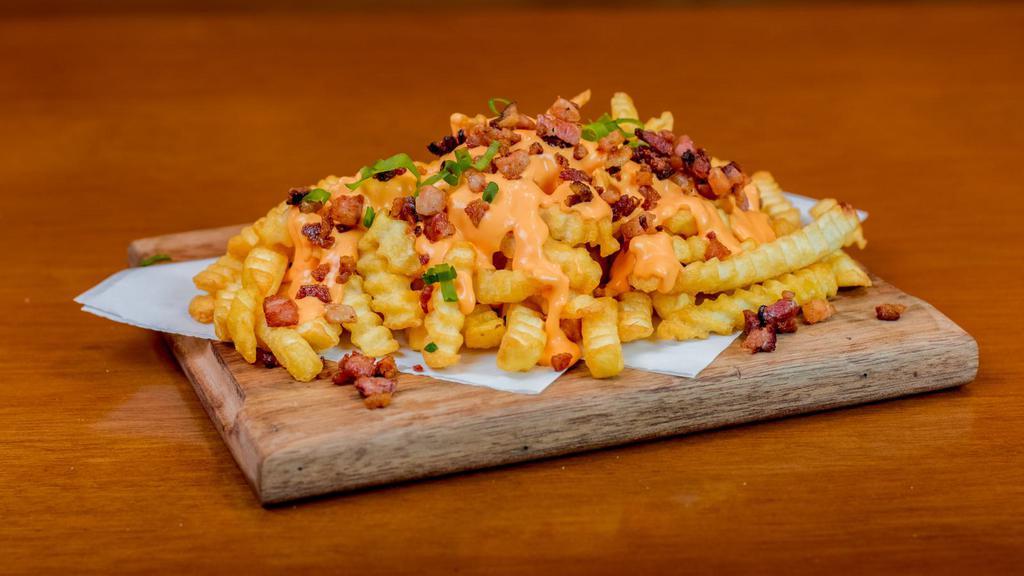 Bacon Cheese Fries · Delicious fries topped with fresh bacon and nacho cheese.