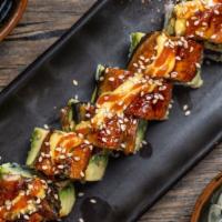 Fire Dragon · spicy tuna, cucumber, topped w/avocado, eel, spicy sauce, eel sauce, & sesame seeds