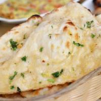 Garlic Naan · Aromatic and scrumptious, leavened, tandoor-baked white bread of
refined white flour, topped...