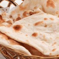 Plain Naan · Delicious and soft leavened white bread resembling a
pita bread, baked in tandoor or clay oven
