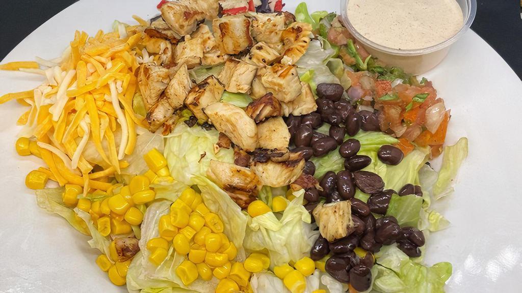 Southwest Salad · Chopped salad mix, grilled chicken, pico, corn, black beans, shredded cheese and tortilla strips. Served with chipotle ranch.
