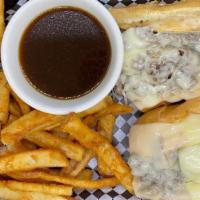 French Dip · Shaved ribeye and melted Swiss cheese. Served with au jus for dipping and fries