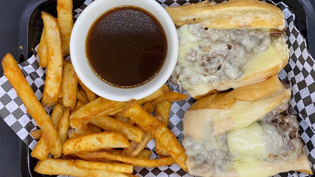 French Dip · Shaved ribeye and melted Swiss cheese. Served with au jus for dipping and fries