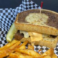 Patty Melt · Sautéed onions, Swiss cheese, 1,000 island dressing, on marbled rye bread. Served with fries.