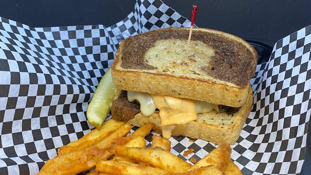 Patty Melt · Sautéed onions, Swiss cheese, 1,000 island dressing, on marbled rye bread. Served with fries.