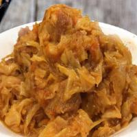 Bigos/Pork Stew · Pork meat and smoked sausages stewed with fresh cabbage, carrots, and onion.