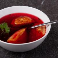 Red Borscht  · Classic beetroot soup, served with three pork or three sauerkraut mushroom pierogies.