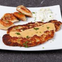 Schnitzel With 5 Pierogies · Thinly sliced pork chop, tenderized and breaded, topped with mushroom and cheese sauce, serv...
