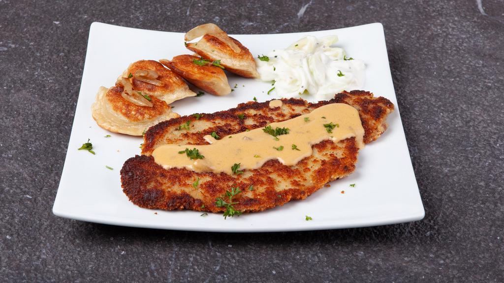 Schnitzel With 5 Pierogies · Thinly sliced pork chop, tenderized and breaded, topped with mushroom and cheese sauce, served with a cucumber salad.