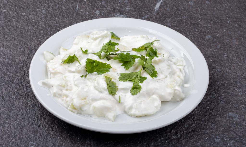 Cucumber Salad · 8oz  - Cucumber with sour cream and spices.