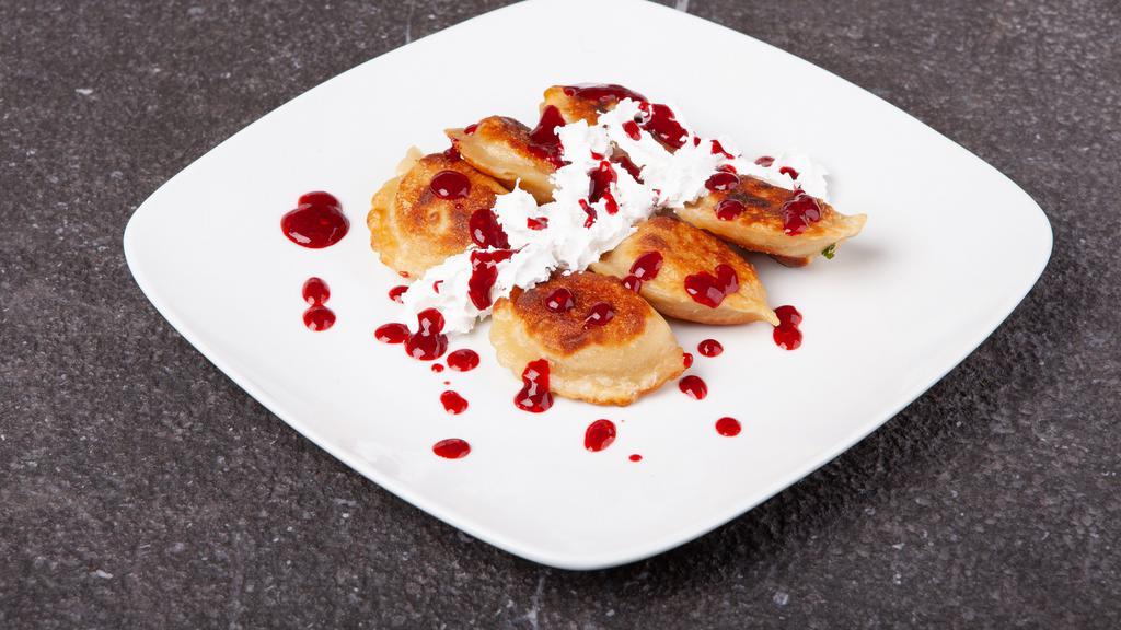 Sweet Cheese Pierogies · 5 sweet cheese Pierogies served with whipped cream and homemade raspberry jam.
