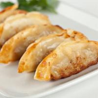 Chicken Dumplings-Gyoza (5 Pcs) · Craveworthy chicken dumplings stuffed with fresh garlic, ginger and scallions. Pan fried unt...