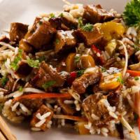 Beef Fried Rice · Traditional dish of tender strips of sirloin, vegetables, eggs, crisp rice, and a rich, full...