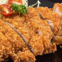 Chicken Katsu · Traditional chicken fillet breaded with flour, egg, and Japanese panko breadcrumbs, then dee...