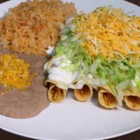 #1. Five Rolled Tacos · Topped with guacamole, lettuce, and cheese