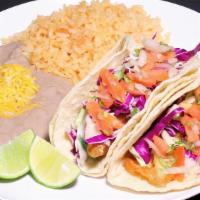 #14. Two Fish Tacos · Two breaded and fried fish tacos topped with tartar sauce, pico de gallo, and cabbage